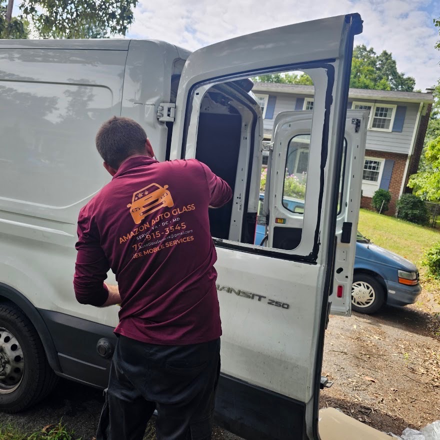 Technician loading glass into the Amazon Auto Glass mobile van
